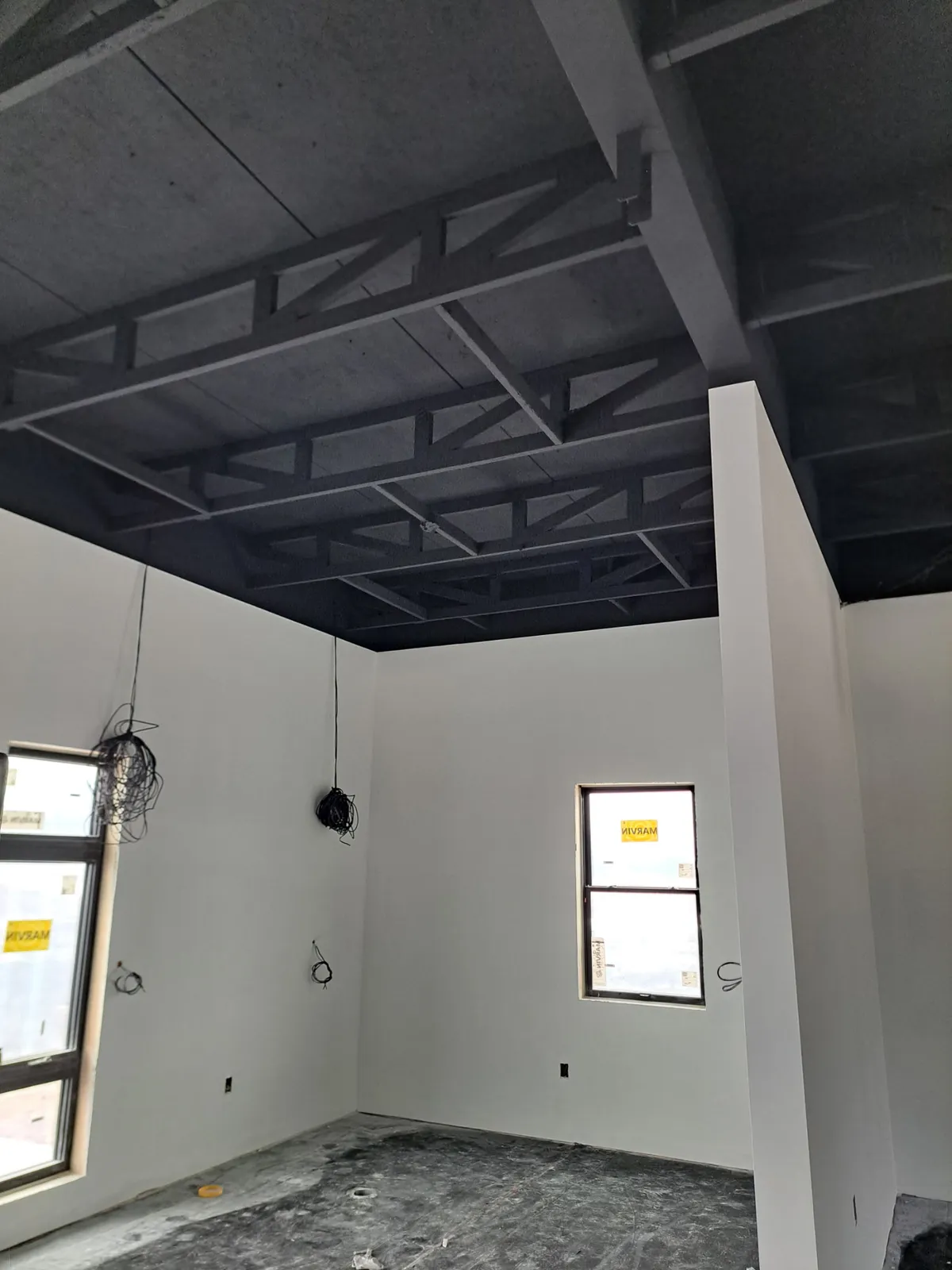 Interior Painting - Spraying Open Ceiling in SW 6258 Tricorn Black in Holland Michigan